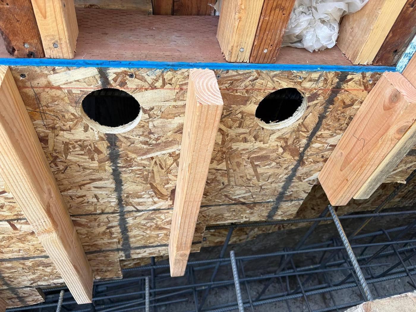 Round pour holes in the forms below the sill